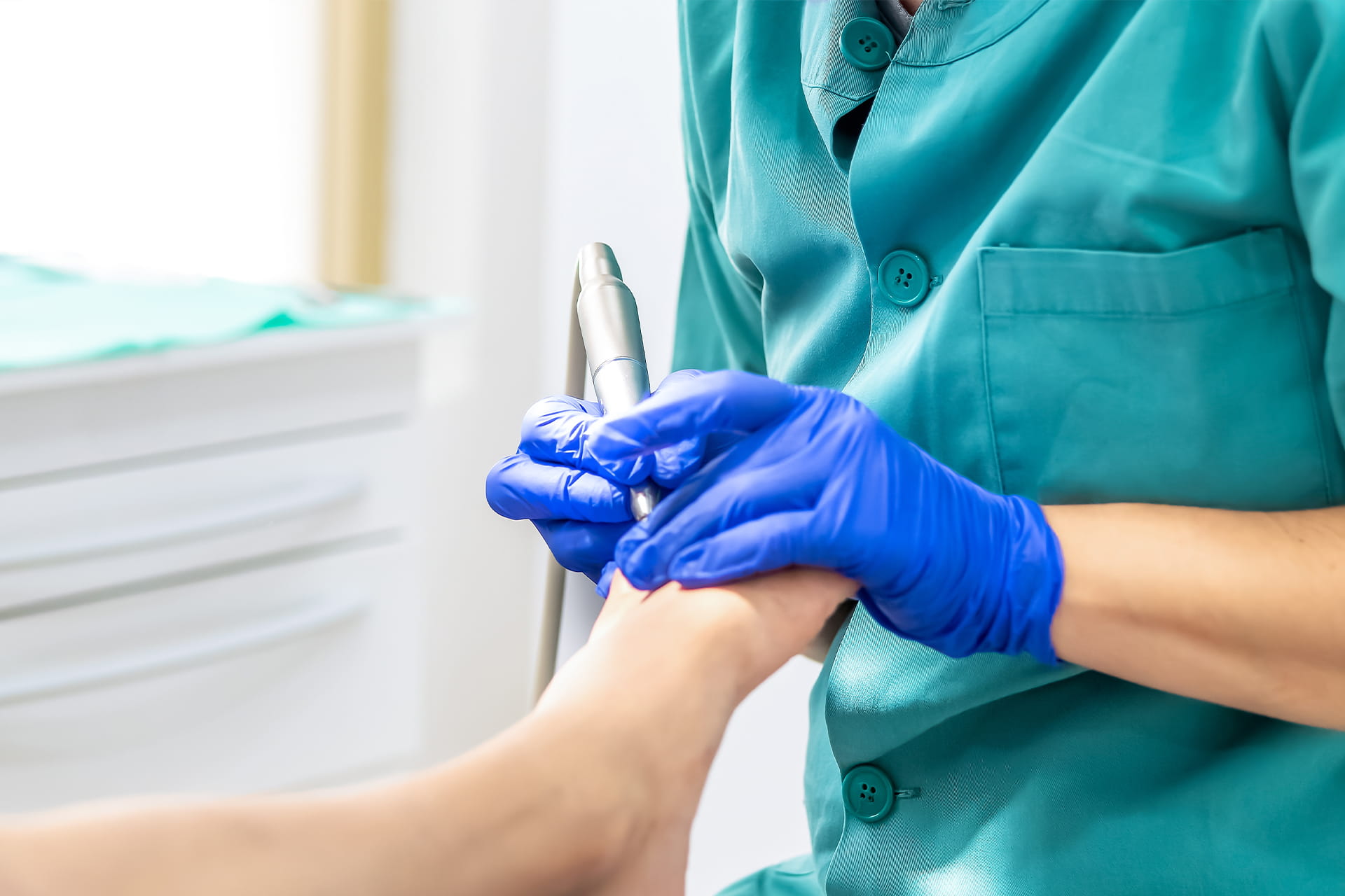 Podiatrist providing bedside foot care